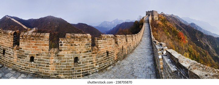 China The Great Wall panoramic view on top of mountains brick wall segment in autumn with yellow trees