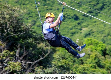 China, Hainan Island - December 1, 2018: Yalong Bay Tropical Paradise Forest Park,extreme rest, Zip Line, downhill on a rope or rope stretched at an angle, editorial.  - Shutterstock ID 1267600444