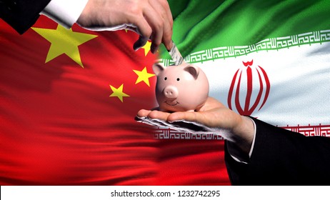 China Investment In Iran, Hand Putting Money In Piggybank On Flag Background