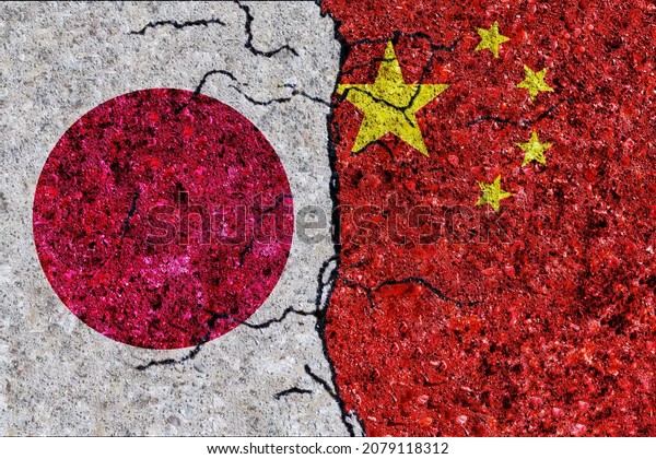 China and\
Japan painted flags on a wall with grunge texture. China and Japan\
relations. Japan and China flags\
together