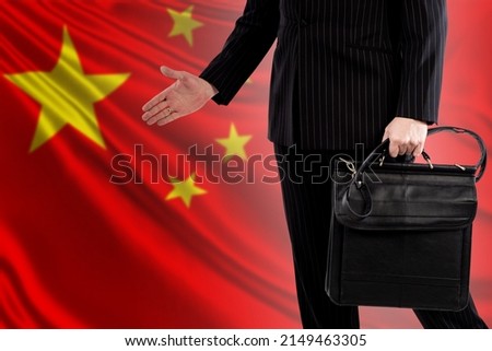 China politician on background of Chinese flag. Portrait of China politician without face. He makes hand gesture. Concept member of Chinese Communist Party. Negotiations with China Communist Party.
