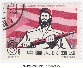 CHINA PRC - 1962 July 10: An 8 Fen Carmine, Rose And Black Postage Stamp Showing Cuban Communist Soldier And Flag. Chinese Support Of Cuba