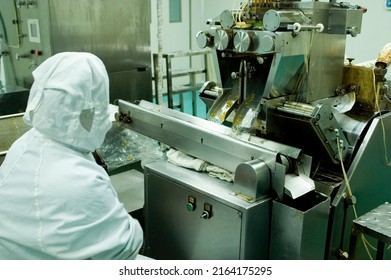 CHINA, SHANDONG PROVINCE - SEPTEMBER 25, 2008: Chinese Pharmaceutical Factory With High Hygine Levels Producing Soft Gel Pills.