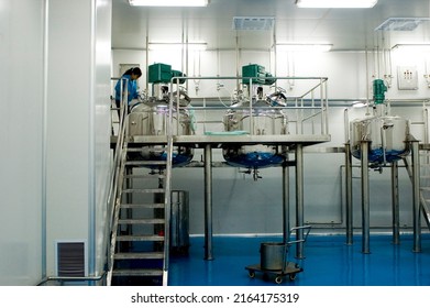 CHINA, SHANDONG PROVINCE - SEPTEMBER 25, 2008:: Chinese Pharmaceutical Factory With High Hygine Levels Producing Soft Gel Pills.