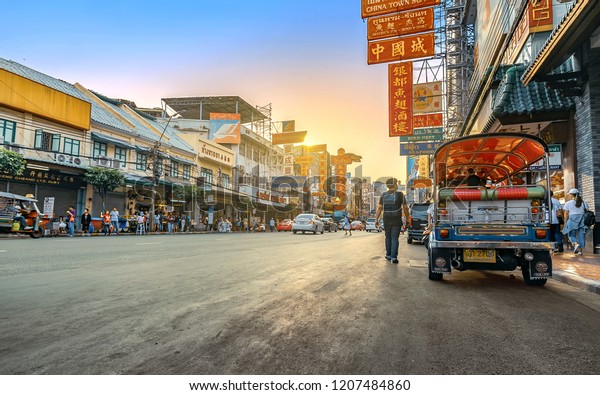 CHINA TOWN, BANGKOK THAILAND - 12 MAY 2018:
Sunset at Yaowarat road with Tuk Tuk Taxi, The main street of China
Town in Bangkok , Yaowarat is one of the famous landmark of Chinese
Arts and Buildings