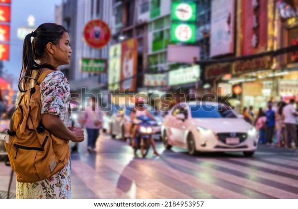 China town\
Bangkok Thailand, colorful streets of China Town Bangkok.Asian\
woman with bag, tourist visiting\
Chinatown