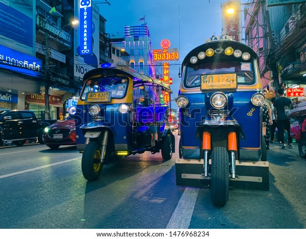 CHINA TOWN\
YAOWARAT ROD BANGKOK THAILAND - 11/08/2019 : Tuk Tuk rickshaw taxi\
service stop at china town Yaowarat\
road
