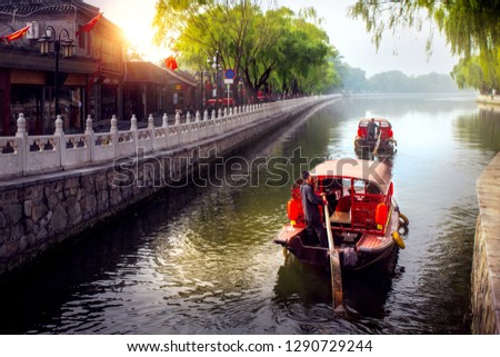 China traditional tourist boats on Beijing canals of Qianhai lake at ShiChaHai district in Beijing, China