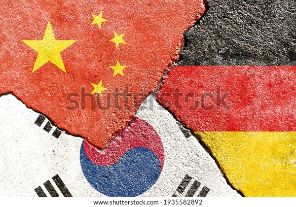 China VS Germany VS South Korea national flags
icon on broken weathered wall with cracks, abstract international
country political economic relationship conflicts pattern texture
background wallpaper