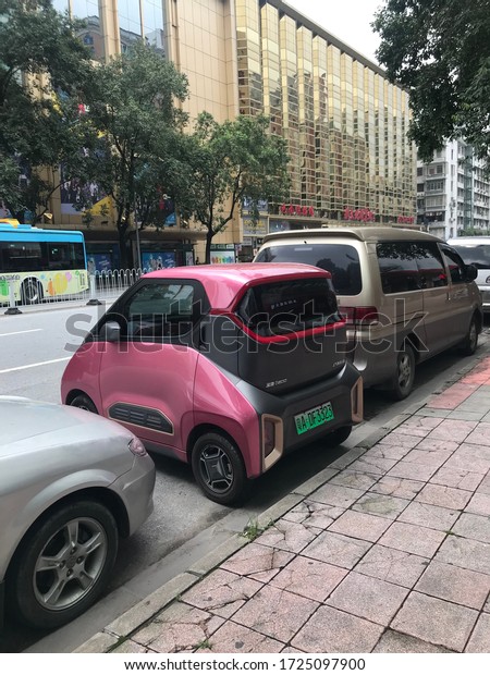 China, Year 2019: Baojun E200, electric\
small city car parked in a street of\
Guangzhou.