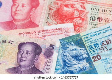 China Yuan And Hong Kong Dollar Banknotes. RMB HKD Money