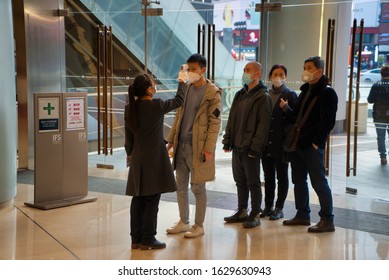 CHINA,CHENGDU,Chunxi Rd.-JANUARY 29,2020: Coronavirus Epidemic In China .People Check Their Body Temperature.