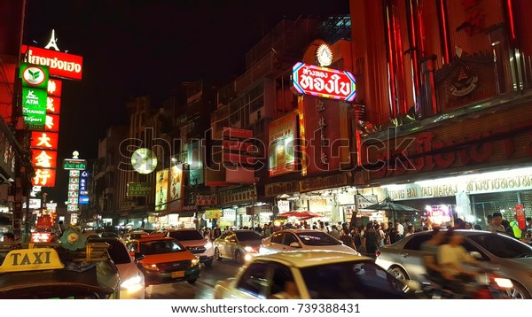 CHINATOWN, BANGKOK,\
THAILAND - 22 October, 2017: Shops and Cars on Yaowarat road, the\
main street of China\
town.