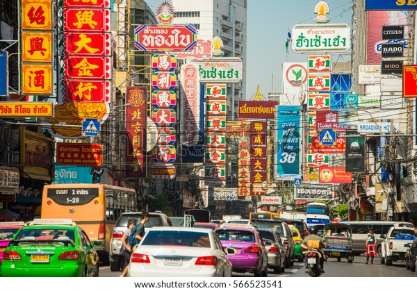 CHINATOWN, BANGKOK, THAILAND - Jan 27, 2017 - Cars\
and shops on Yaowarat road. Chinatown with notable Chinese\
buildings, restaurants and decoration. Busy Yaowarat Road on\
chinese new year
