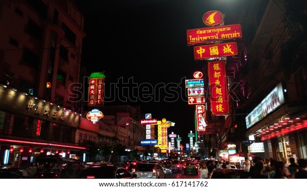 CHINATOWN\
BANGKOK, THAILAND - SEPTEMBER 9, 2016: Cars, people and shops on\
Yaowarat road, the main street of China town.The attraction tourist\
place for shopping and eating at\
night.