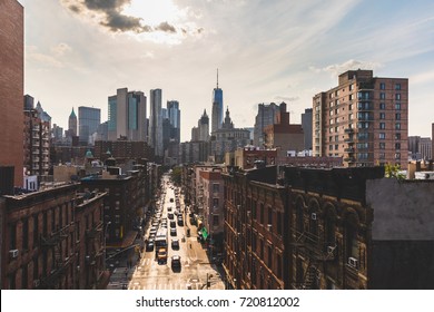Chinatown and downtown Manhattan in New York from Manhattan bridge. Beautiful aerial cityscape with busy street in foreground and skyscrapers on background