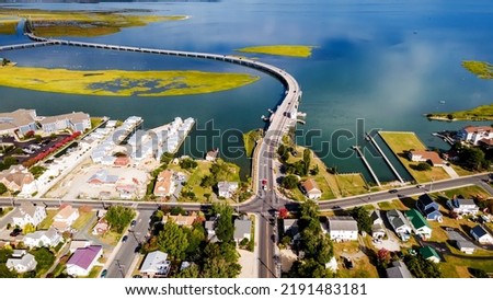 Chincoteague bridge across the Chincoteague Bay in Virginia and views of the waterfront. Drone view.