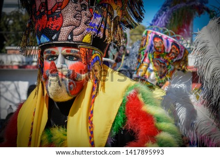 CHINELO is a representative character with mask and a  tunic, a large hat and gloves. They are traditional dancers of mexican carnavals. 