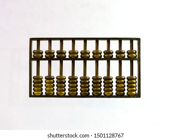 Chinese Abacus Ancient Antique Counting Machine In Bronze Metal. Chinese Abascus Hand Mechanical Calculating Machine. Close Up Isolated On Light Background.  