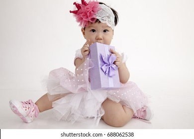 Chinese Baby Wearing Party Dress With Purple Gift Box