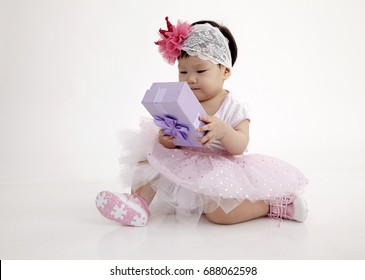 Chinese Baby Wearing Party Dress With Purple Gift Box