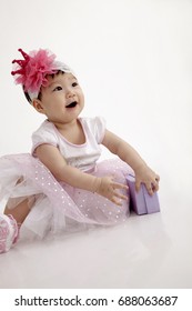 Chinese Baby Wearing Party Dress With Purple Gift Box