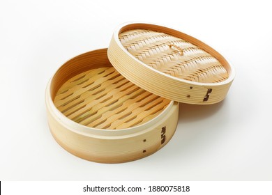 Chinese bamboo steamer basket isolated on white background - Powered by Shutterstock