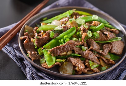 Chinese Beef And Snowpeas Stirfry On Plate