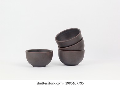 A Chinese black ceramic teacup isolated on a white background. - Shutterstock ID 1995107735