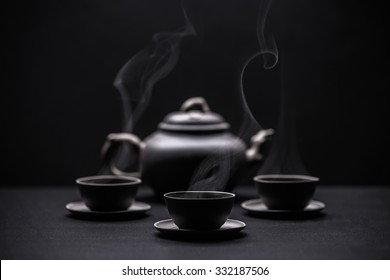 Chinese black teapot and teacups 