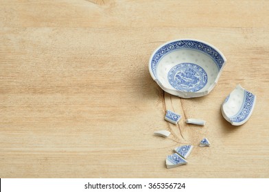 A Chinese Bowl Broken Into Pieces