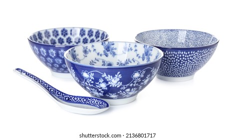 Chinese bowls with spoon on white background