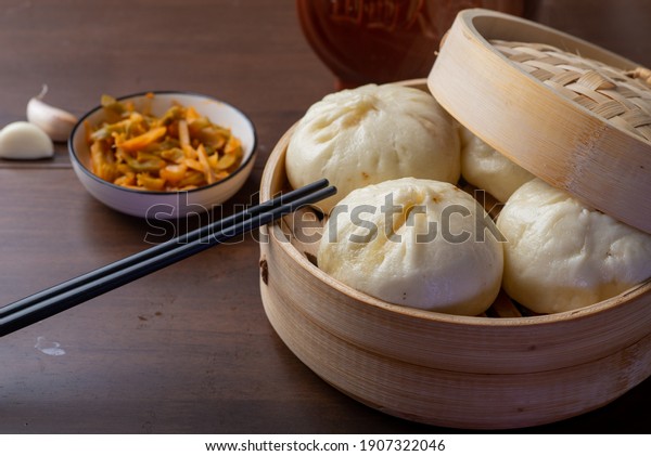 Chinese breakfast. Steamed buns and porridge are on\
the table