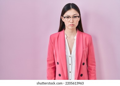 Chinese Business Young Woman Wearing Glasses Depressed And Worry For Distress, Crying Angry And Afraid. Sad Expression. 