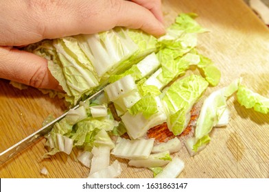 Chinese Cabbage, Bok Choy Is Chopped With A Knife