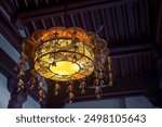 Chinese ceiling lamp at Buddha Tooth Relic temple and museum based on Tang dynasty architectural style in Singapore. Famous travel destination at Chinatown area.