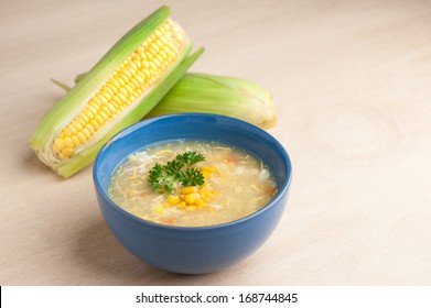 Chinese Chicken And Corn Soup With Fresh Corn Cob On The Side.