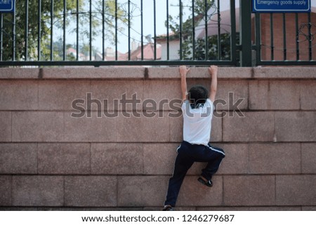 Similar – Athletic man warming up before running.