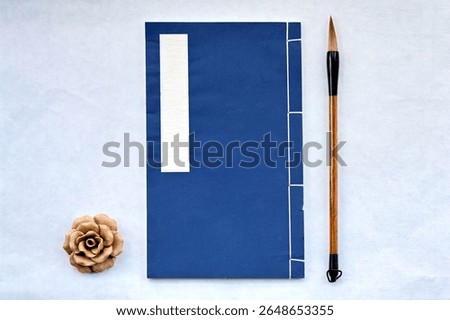 Chinese classical thread bound books and fur pens
