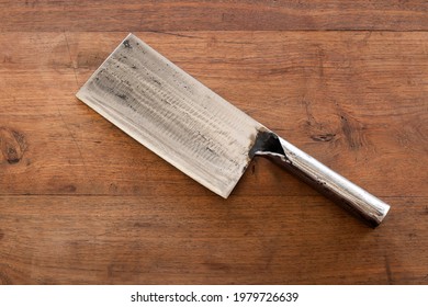 Chinese Cleaver Knife Placed On Old Wooden Table