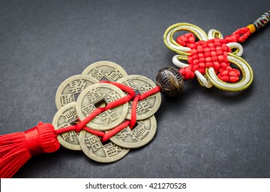 chinese coins of luck on black background.