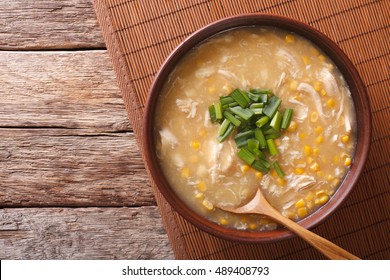 Chinese Corn And Chicken Soup In A Bowl Macro On The Table. Horizontal View From Above
