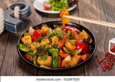 Chinese Dish With Fried Fish And Vegetables With Chopsticks.