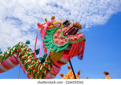 Chinese Dragon Dance Performance Parade with Blue Sky Background in Chinese New Year Celebration Festival at Thailand  - Powered by Shutterstock