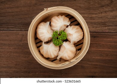 Chinese dumpling in a bamboo steamer box