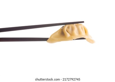 Chinese dumplings and chopsticks isolated on a white background. - Shutterstock ID 2172792745