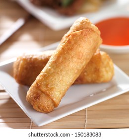 Chinese Egg Rolls With Sauce On Plate