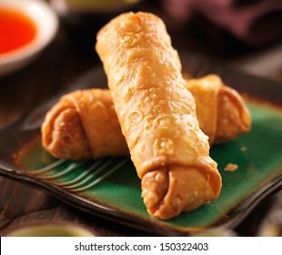 Chinese Egg Rolls With Sauce On Plate