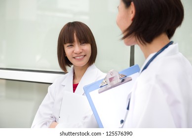 Chinese Female Medical Student In A Discussion