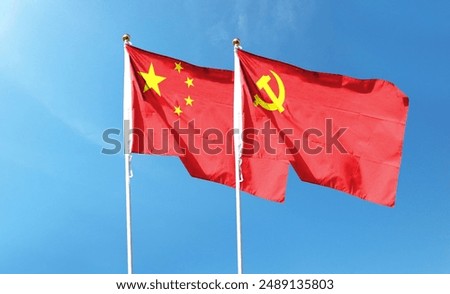 Chinese flag with Chinese Communist Party flag on cloudy sky. flying in the sky
